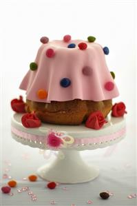 Gugelhupf with pink marzipan and coloured chocolate beans