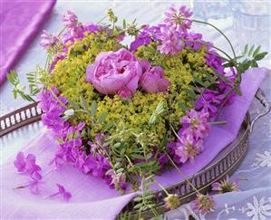 Heart of lady's mantle with peonies