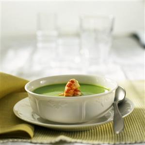 Cream of pea soup with prawns