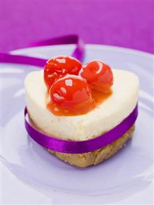 Heart-shaped quark cake with cocktail cherries