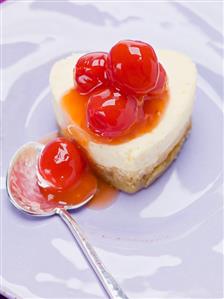 Heart-shaped quark cake with cocktail cherries