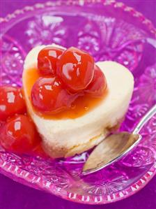 Heart-shaped quark cake with cocktail cherries