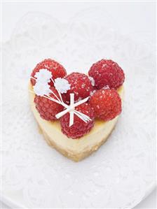 Heart-shaped quark cake with raspberries