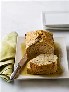 Banana and pecan bread, partly sliced