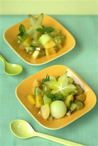 Fruit salad: melon, grapes, kiwi fruit and caramabolas