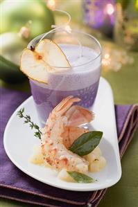 Red cabbage foam soup with pear and langoustines