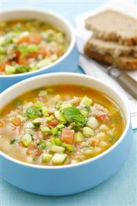 Cold tomato and gherkin soup with bread