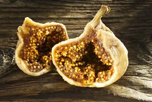 Dried figs on wooden board