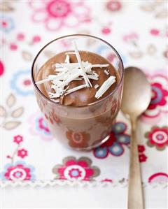Mousse au chocolat in glass with white chocolate shavings