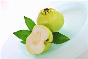 Whole guava and half of a guava
