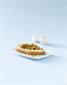 Ciabatta topped with soft cheese, mango, red pepper & rocket
