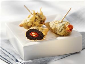 Prunes stuffed with chillies in batter