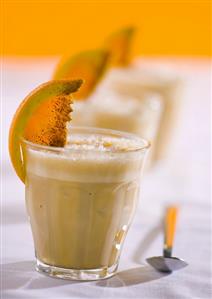 Three glasses of iced coffee drink with cinnamon syrup & orange