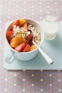 Muesli with red berries in a cup