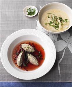 Creamy kohlrabi soup, beetroot bouillon with pumpkin seed quark dumplings