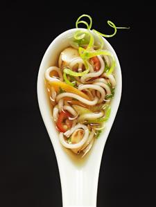 Asian noodle soup in spoon