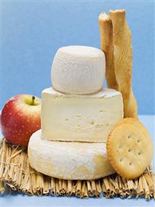Various cheeses, cracker, savoury sticks and apple