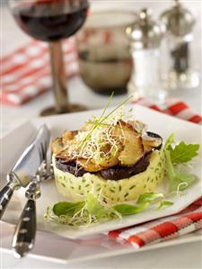 Black pudding and apple on mashed potato