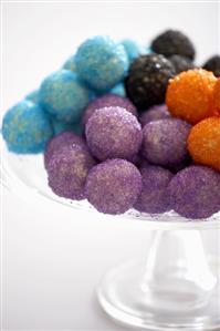 White chocolates rolled in coloured sugar