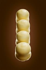 Four white chocolate teacakes in a row