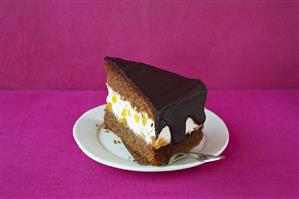 A piece of apricot chocolate cake
