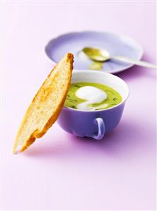 Minted cream of pea soup with toast