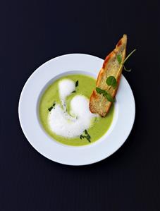 Minted cream of pea soup with toast