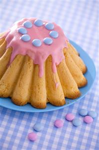 Polish Easter cake with pink icing and chocolate beans