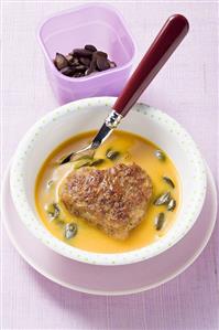 Heart-shaped burger with pumpkin soup