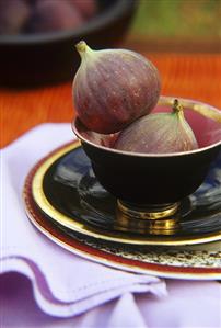 Two figs in a bowl