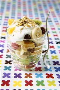 Fruit salad with yoghurt and seeds