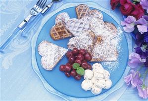 Waffles with cherry compote and walnut ice cream