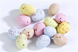 Chocolate eggs with pastel coloured sugar coating