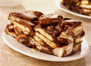Chocolate and nut refrigerator cake (made with biscuits)