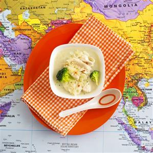 Chicken soup with broccoli on map (Thailand)