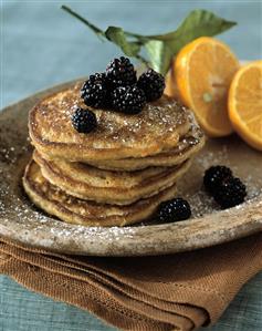 A Stack of Pancakes Topped with Blackberries