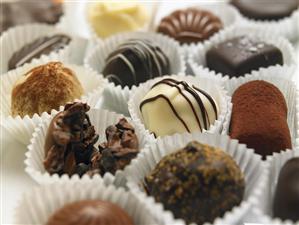 Various Chocolate Truffles in Paper Cups