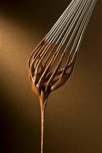 Chocolate Cake Batter Dripping From Whisk