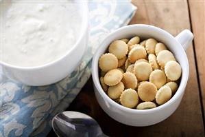 Cup of Oyster Crackers with Bowl of Clam Chowder