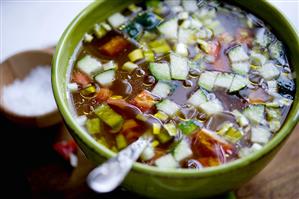 Bowl of Vegetable Soup with Spoon