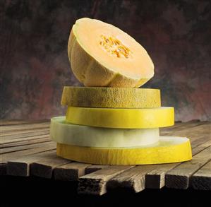 Stacked Assorted Melon Slices Topped with Cantaloupe Half