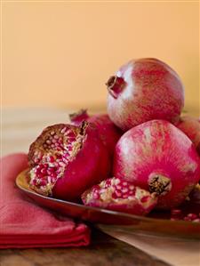 Fresh Pomegranates; Whole and Broken