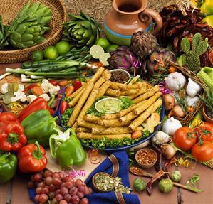 Platter of Taquitos Surrounded by Fresh Produce
