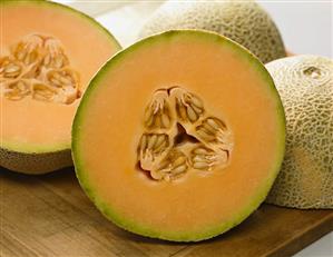 Halved Cantaloupes on a Cutting Board