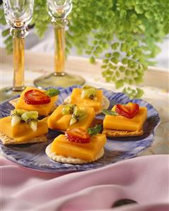 Fruit and Cracker Appetizers on Blue Plate