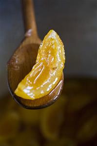 Candied Orange Slice on a Wooden Spoon